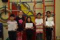 Big Buds proudly showing their Grade One button badges and certificates after achieving the grade in the Blossom Yoga Syllabus