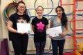 Teen Buds proudly showing their Grade Four certificates and button badges after achieving the grade in the Blossom Yoga Syllabus
